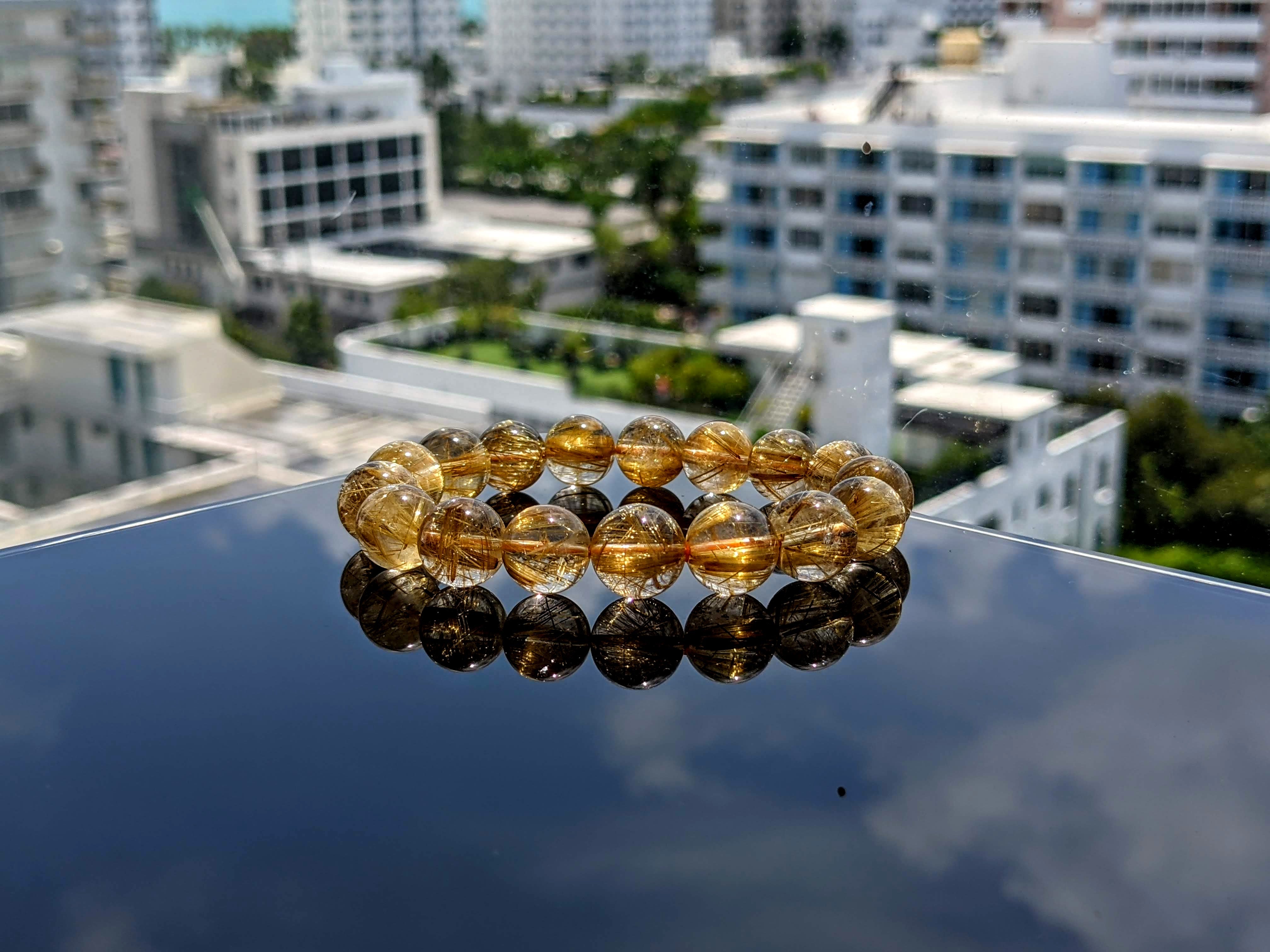 Golden rutilated sale Quartz gemstone beads loom woven with brown leather and Bali style vermeil (18k gold over sterling silver) closure