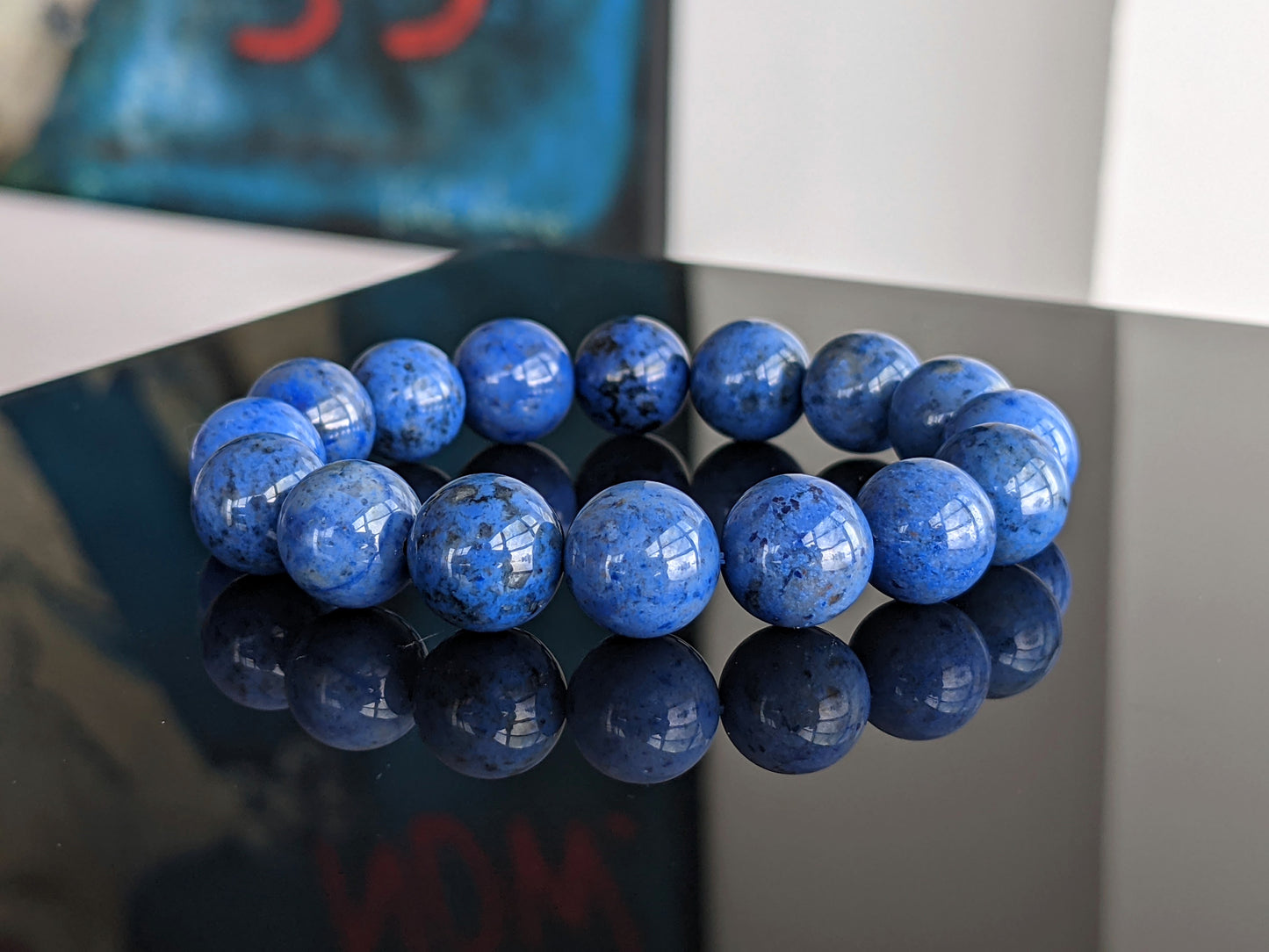 This is the main image for the 3A+ high quality Dumortierite.  The Dumortierite is mainly blue with black, and the beads have high a high luster finish.  It is the finest Dumortierite beads on the market. 