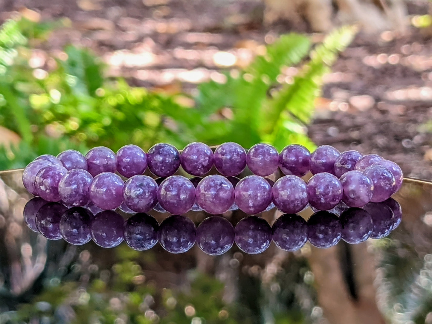 This is the main picture for the purple Lepidiolite bead bracelet.  The beads are incredibly colorful, and well made.  The bracelets are made using 8 mm size beads.  It is excellent.